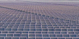 adani green commissions 180 mw solar power plant in rajasthan